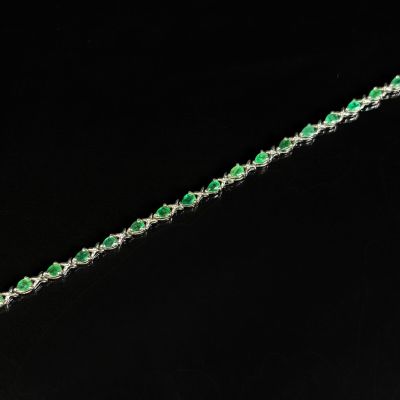 Bracelet souple en argent 800/1000 orné en serti-griffes d'é…