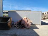 a pile of junk in the middle of a parking lot