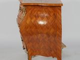 a small wooden chest on wheels with a wooden top