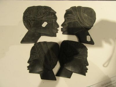 four pieces of art that are on display on a table