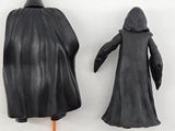 star wars action figures sit on a white surface next to each other