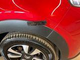 a close up of a car tire with a sticker on it