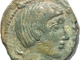 gros plan d'une pièce de monnaie sur laquelle figure un visage de femme