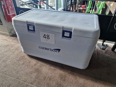 a cooler that is sitting on the floor in the room