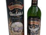 a bottle of whisky next to a canister