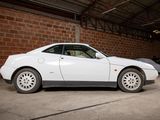a white car that is parked in a garage