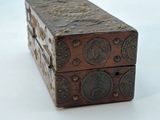 a small wooden box that is sitting on a white surface