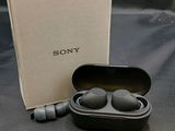 a box with a pair of ear buds in it