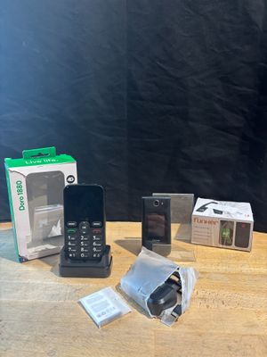 several cell phones are sitting on a table next to a box