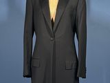 an image of a black suit on a mannequin stand