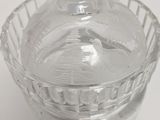 a glass container with a bird inside of it