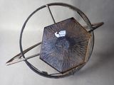 a metal object with a clock on top of it
