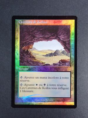 a close up of a card with a picture of a cave in the background