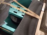 some pieces of wood are laying on a pallet in a warehouse