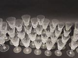 a lot of wine glasses sitting on a table