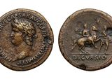 an ancient coin with a woman on a horse and a man on a horse
