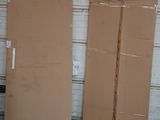 two cardboard boxes sitting next to each other in a garage
