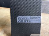 a close up of the back of a small black box