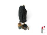 une paire de chaussures et un sac posés sur une surface blanche