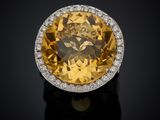 an oval citrine and diamond ring
