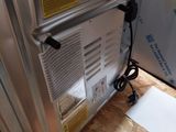 a gas heater sitting on the floor in a room