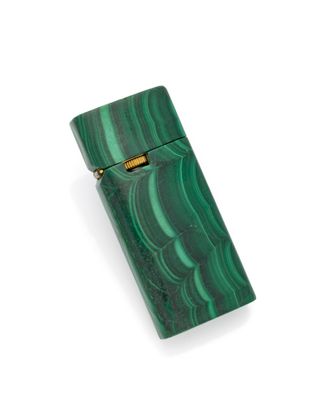 an image of a green lighter sitting on top of a white surface