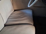 a view of the inside of a car from the driver ' s seat