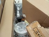 a cardboard box full of items in the middle of a room