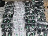 many bags of electronic equipment on a table