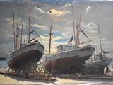 two boats that are sitting in the sand