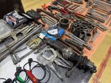 many tools on a table that are sitting on the floor