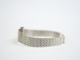 sterling silver bracelet with a textured design on a white background