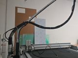 une image représentant une machine en train de découper une feuille de papier