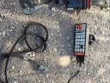 a remote control sitting on the ground next to a remote control
