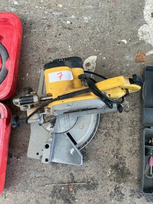 two tools that are laying on the ground next to each other