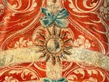 painting of a bell with three angels and a cross on it