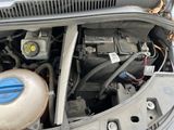a car engine with the hood open and the hood down