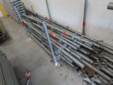 a lot of pipes that are stacked up in a room