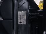 a close up of a car ' s dashboard with a sticker on it