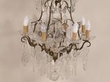 a chandelier that has five lights attached to it