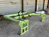 a couple of green tables sitting in front of a building