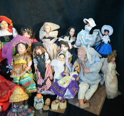 a lot of figurines that are sitting on a table