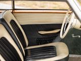 a black and white interior of a car with a steering wheel