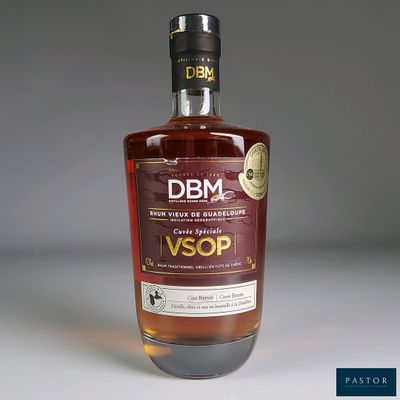 a bottle of whisky sitting on a white surface