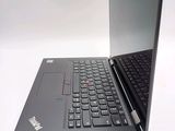 a laptop with a black keyboard sitting on a white surface