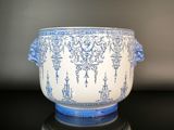 a blue and white bowl sitting on a black table