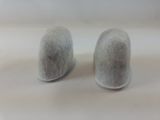 a pair of salt and pepper shakers sitting on a table