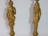 pair of antique brass candlesticks with figures on bases