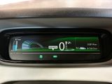 the dashboard of a car with a gps device on it ' s display