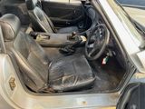 an image of a car with a leather seat and steering wheel